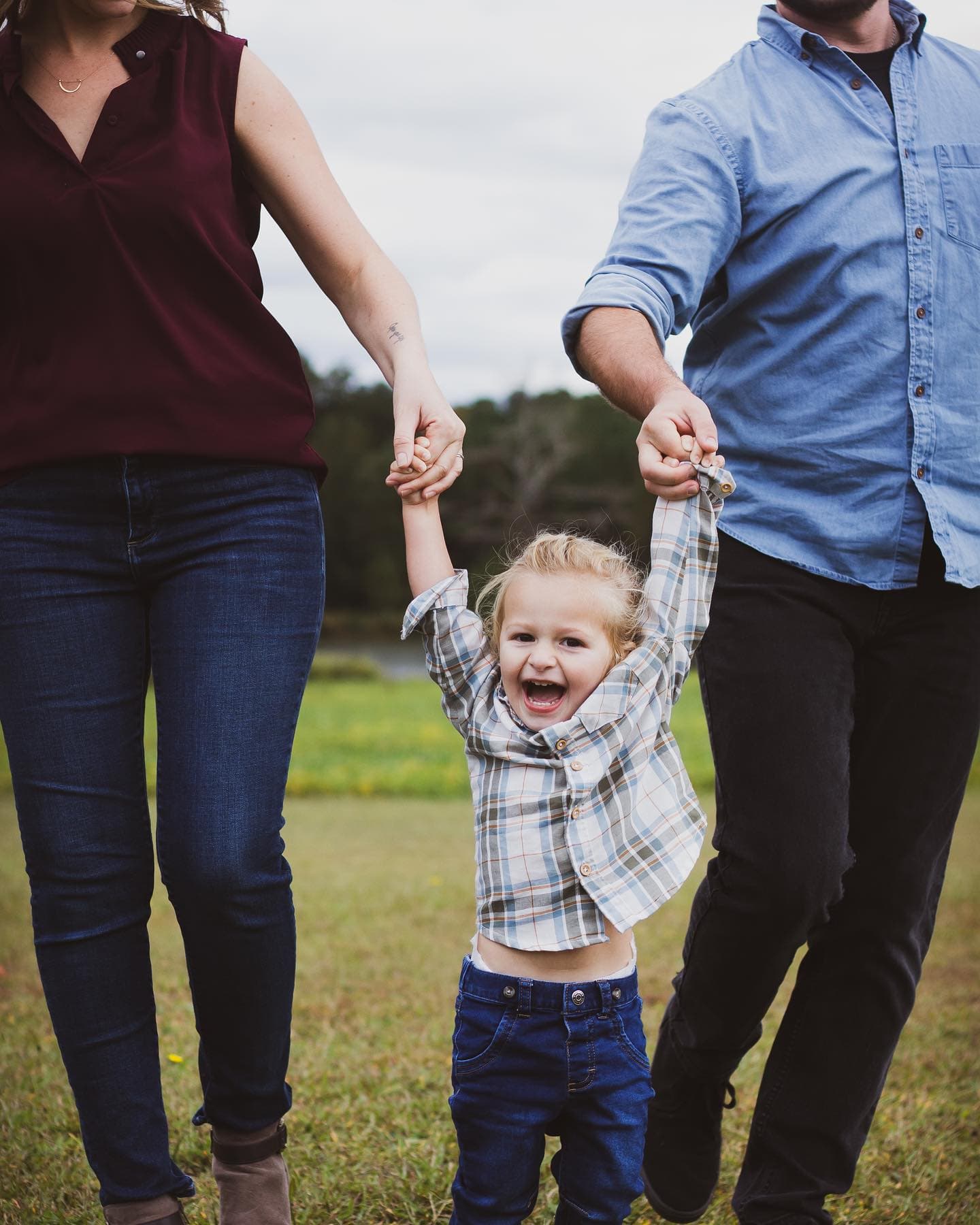 A child mid-laugh during a family session