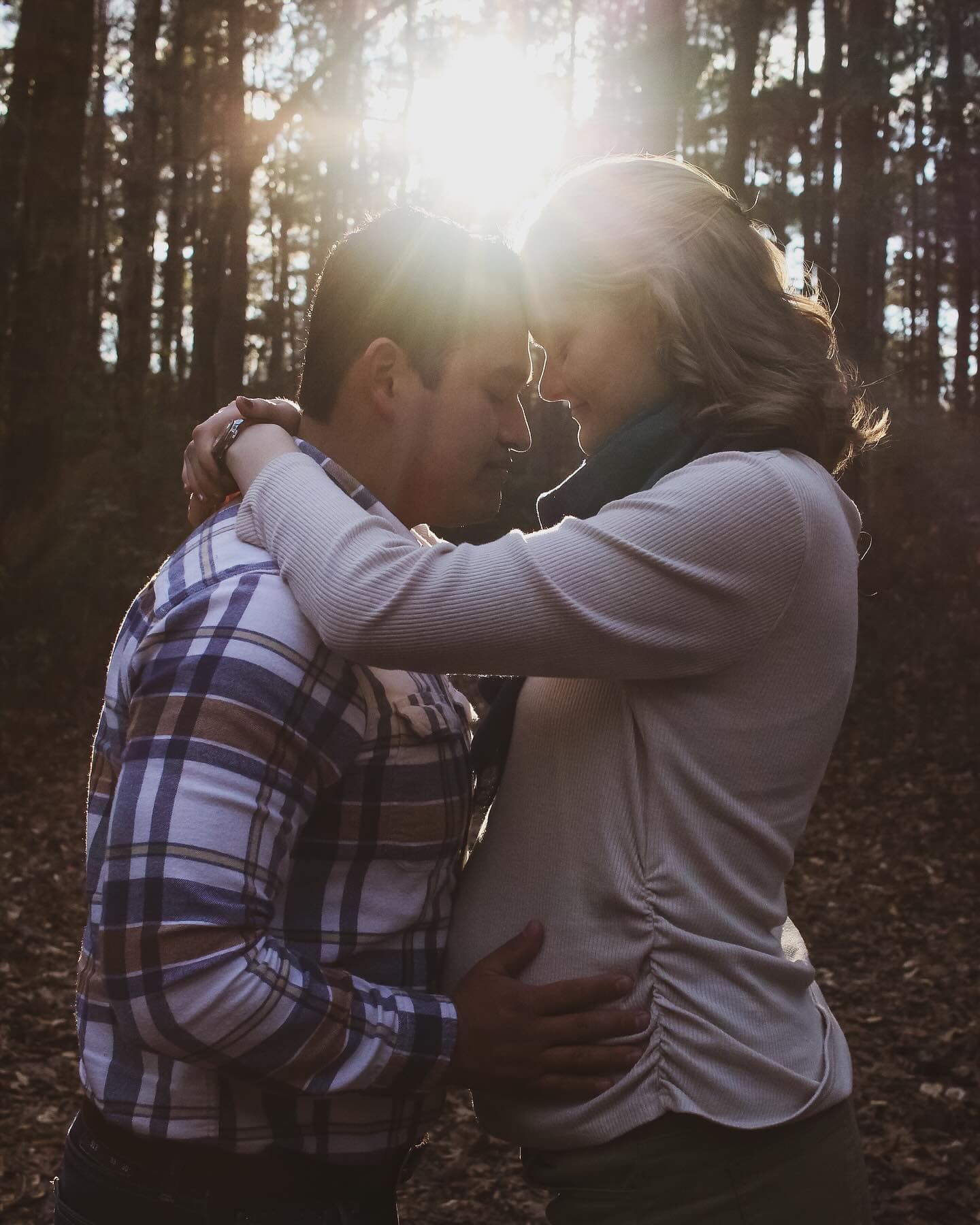 A couple holding each other in the last of the evening sun